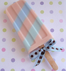 Pink milk chocolate lolly