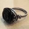 a black rose ring.