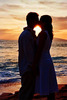 a romantic kiss at sunset